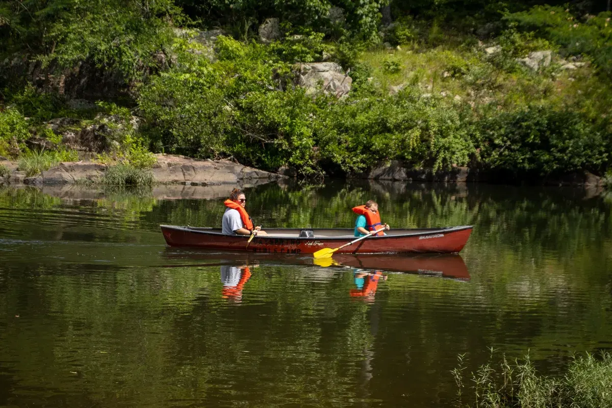 Campers canoeing on Stouts Creek at Dayspring