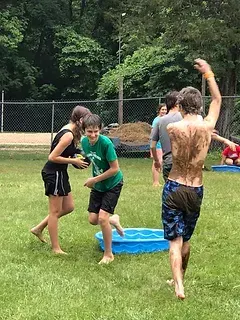 Campers playing a water game