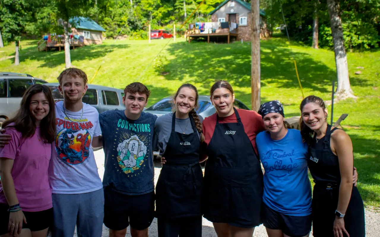 Dayspring volunteers working together to prepare camp meals